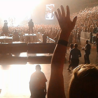 People Waving their hands in the air at a concert