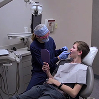 Dentist with Patient in the Chair